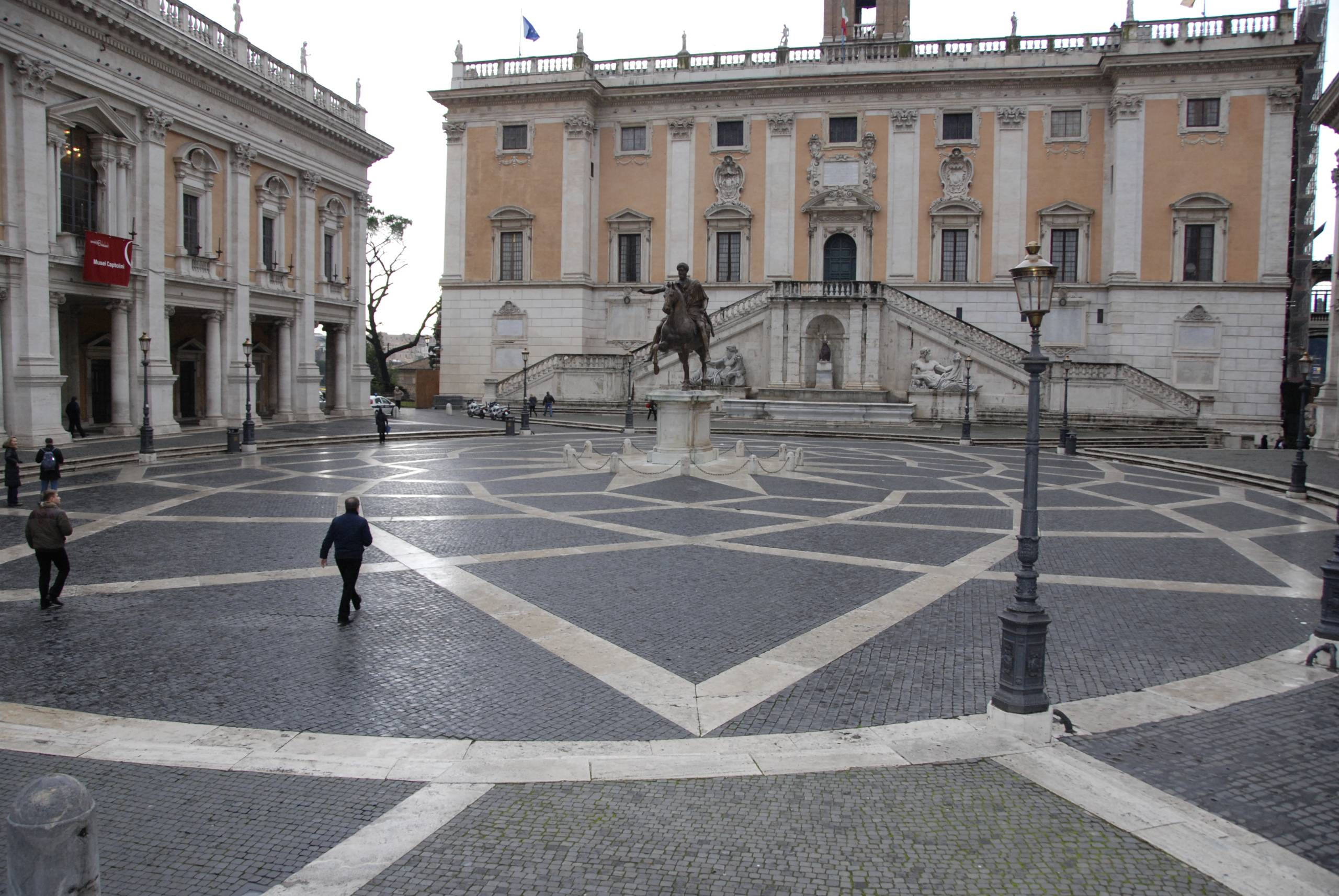 Rome Day Tours Capitoline Museum Tour, image of Michelangelo's amazing piazza, featuring a modern copy of the late 2nd century Equestrian statue of Emperor Marcus Aurelius, finally making sense of Rich's Marcus Aurelius Logo, in which he's at least virtually imposed a modern/ repeatable square rendition of that same pattern onto the original Gilded Bronze Equestrian Statue
