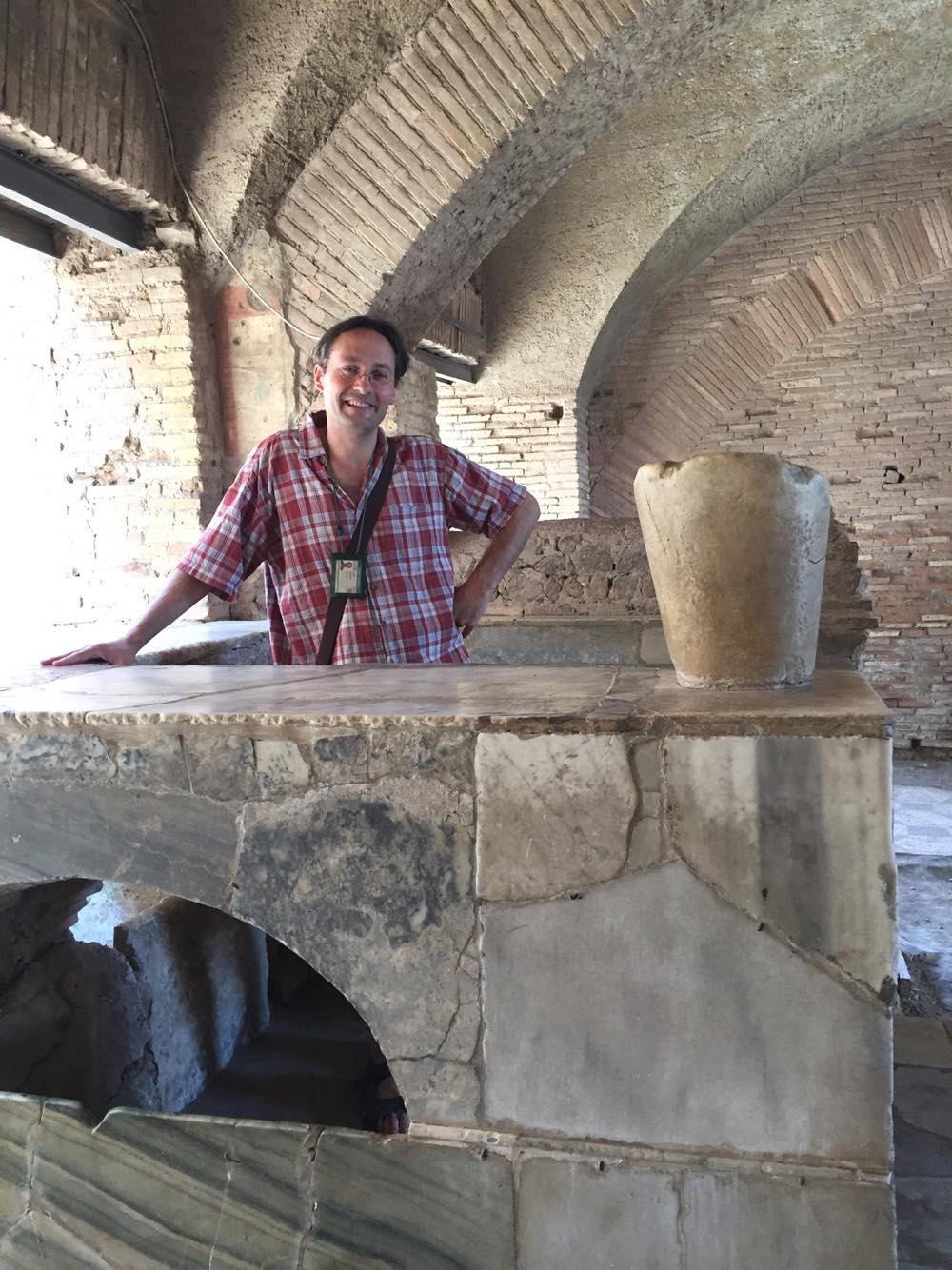 Rome Day Tours image of Rich Brunn touring through an ancient Bar area in Rome's ancient Port city of Ostia Antica.